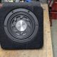 Sub-woofer Speaker with custom housing for positioning in the hole behind the driver seat of a DMC12